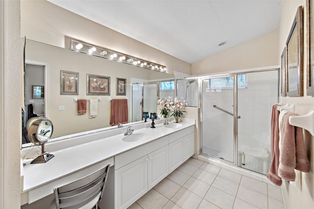 bathroom featuring lofted ceiling, a textured ceiling, a shower with shower door, vanity, and tile patterned flooring