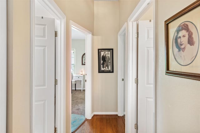 hall with wood-type flooring