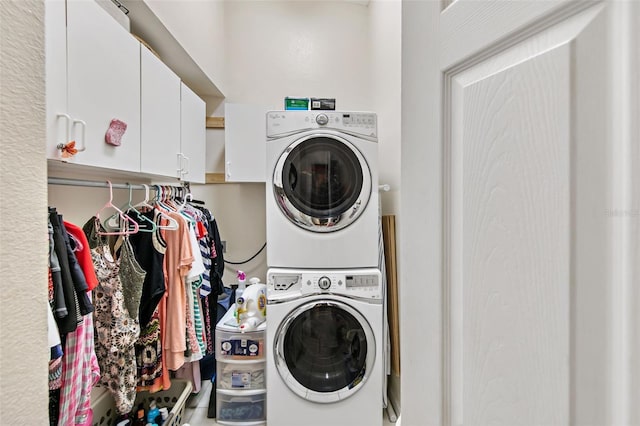 washroom with stacked washer and dryer