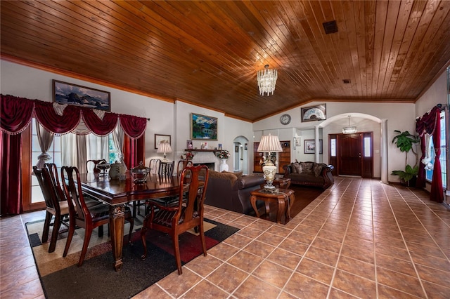 dining area with tile patterned floors, lofted ceiling, wooden ceiling, and an inviting chandelier