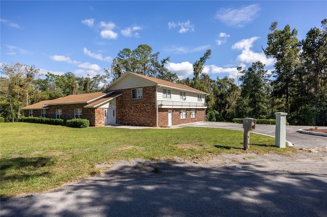 view of side of home featuring a yard