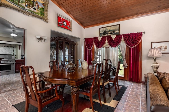 dining room with ornamental molding, vaulted ceiling, tile patterned flooring, and wooden ceiling