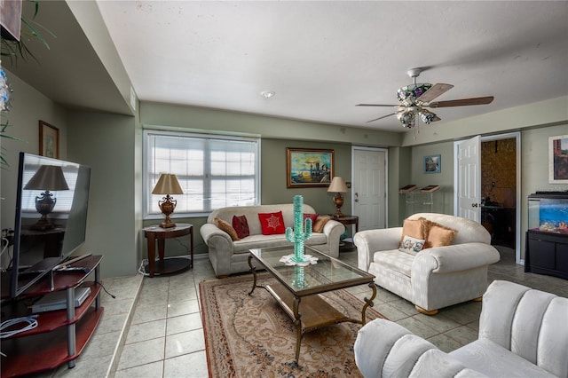 living room featuring ceiling fan and light tile patterned flooring