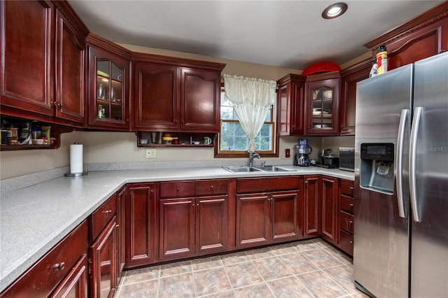 kitchen with sink and stainless steel fridge