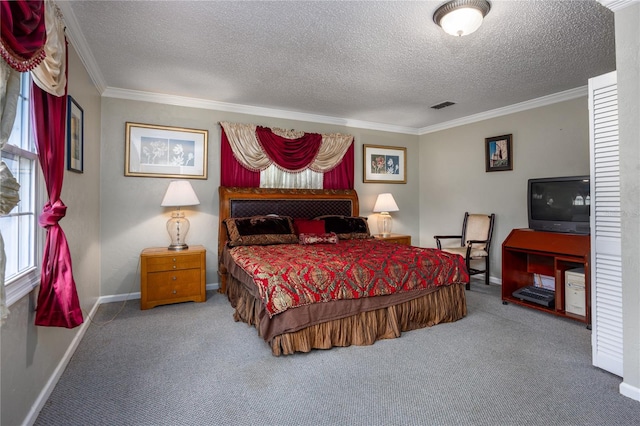 bedroom with a textured ceiling, ornamental molding, and carpet floors