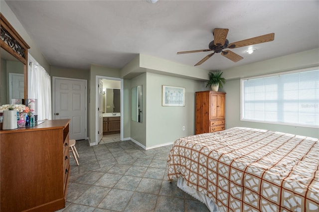 bedroom featuring connected bathroom and ceiling fan