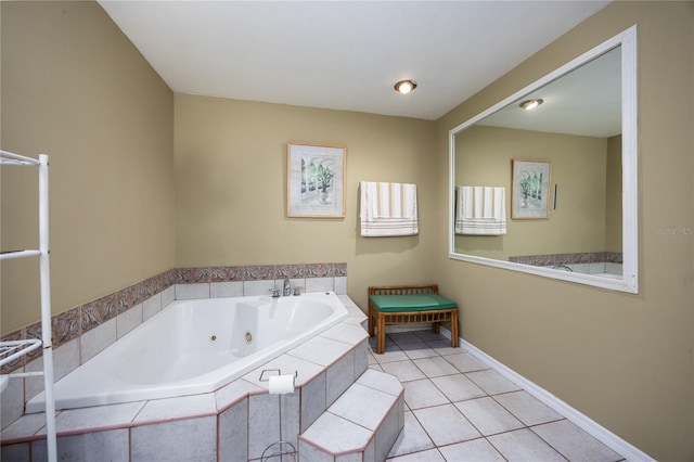 bathroom with a relaxing tiled tub and tile patterned flooring