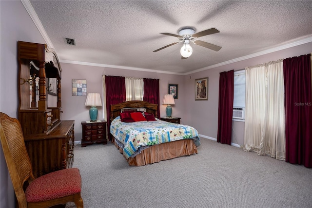 carpeted bedroom with crown molding, a textured ceiling, and ceiling fan