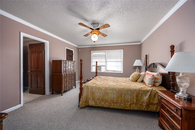 bedroom featuring crown molding, carpet floors, a textured ceiling, and ceiling fan