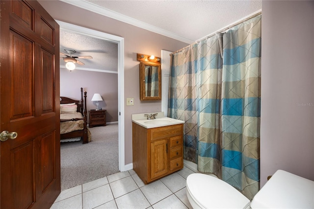 bathroom featuring tile patterned floors, toilet, vanity, a textured ceiling, and ceiling fan