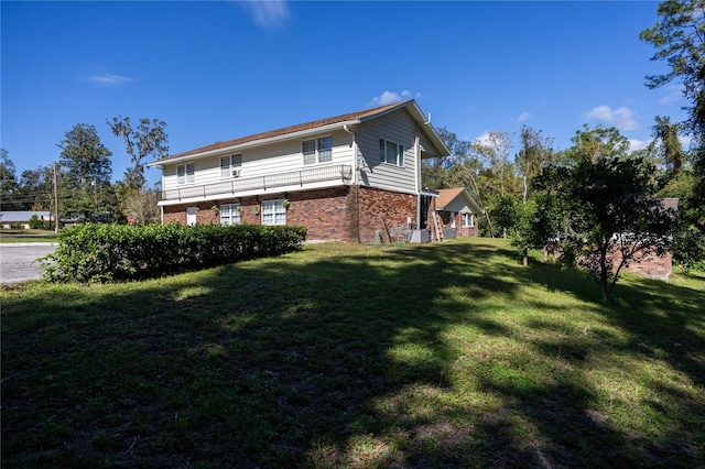 view of home's exterior with a yard