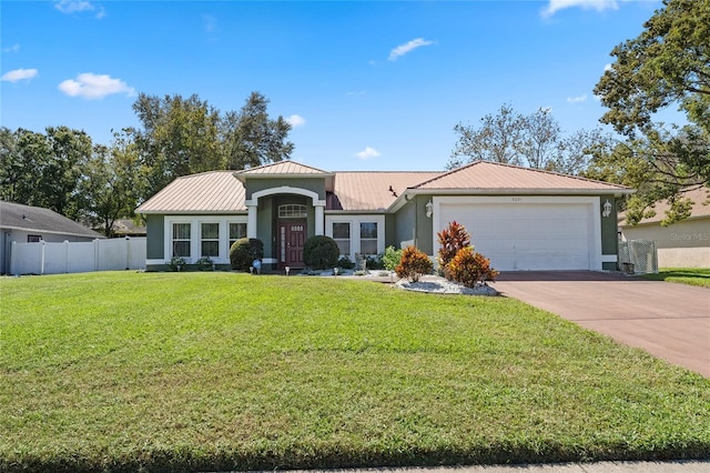 view of front facade with a front yard and a garage