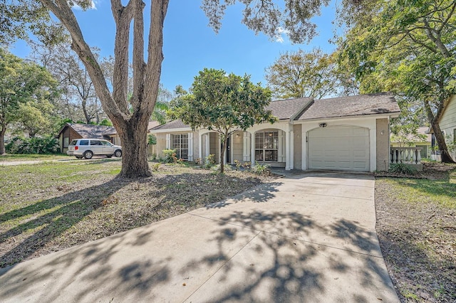 ranch-style home featuring a garage