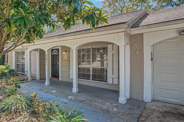 view of exterior entry featuring a garage