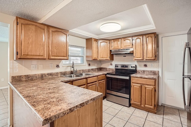 kitchen with a textured ceiling, sink, stainless steel range with electric cooktop, light tile patterned floors, and a tray ceiling