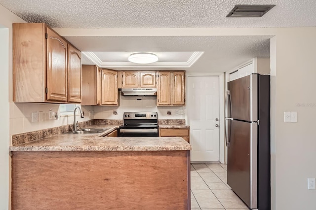 kitchen featuring light tile patterned flooring, sink, kitchen peninsula, appliances with stainless steel finishes, and a raised ceiling