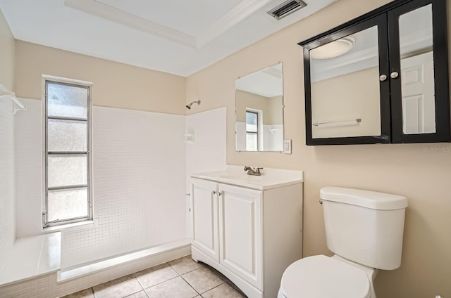 bathroom featuring tile patterned flooring, vanity, crown molding, a shower, and toilet