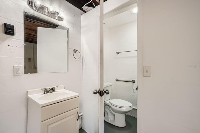 bathroom featuring toilet and vanity