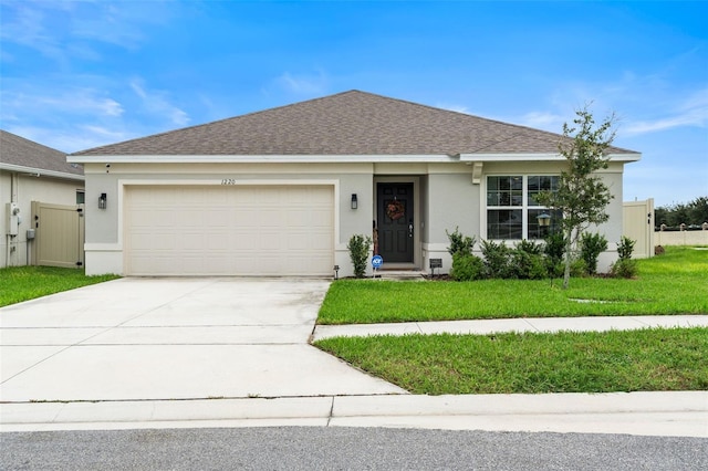 ranch-style home featuring a front yard and a garage