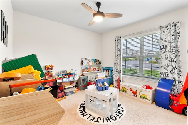 game room with carpet and ceiling fan