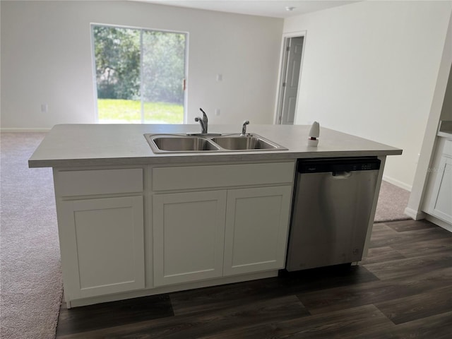 kitchen with white cabinetry, dishwasher, and a center island with sink