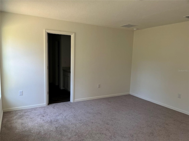 spare room with carpet floors