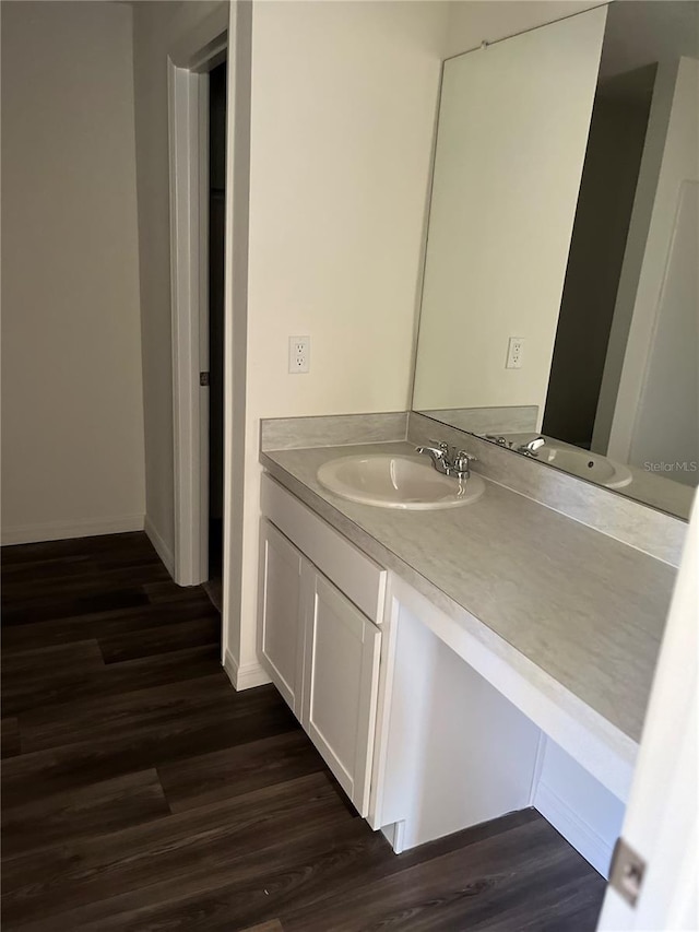 bathroom with vanity and wood-type flooring