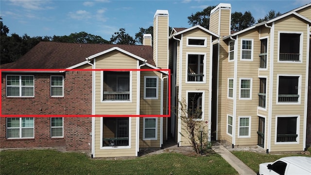 exterior space featuring a front lawn