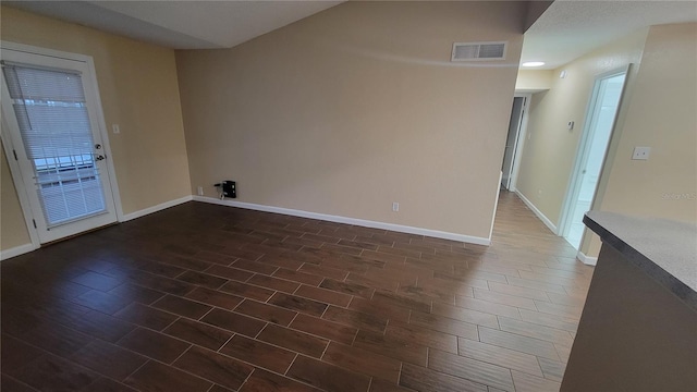 empty room featuring dark hardwood / wood-style floors