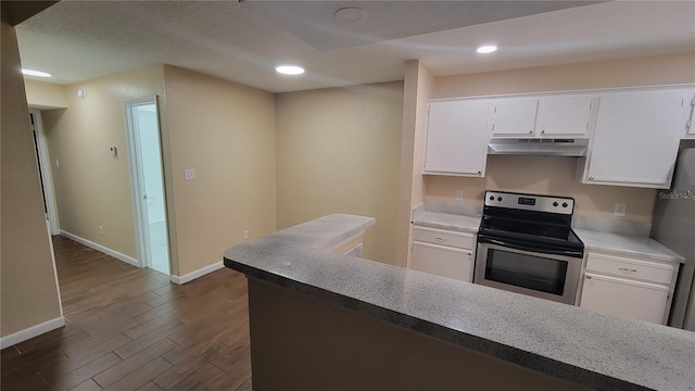 kitchen with dark wood-type flooring, white cabinetry, and stainless steel appliances