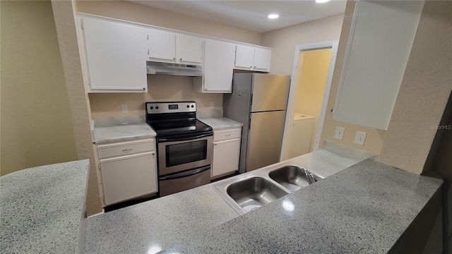 kitchen with white cabinets, under cabinet range hood, stainless steel appliances, light countertops, and a sink
