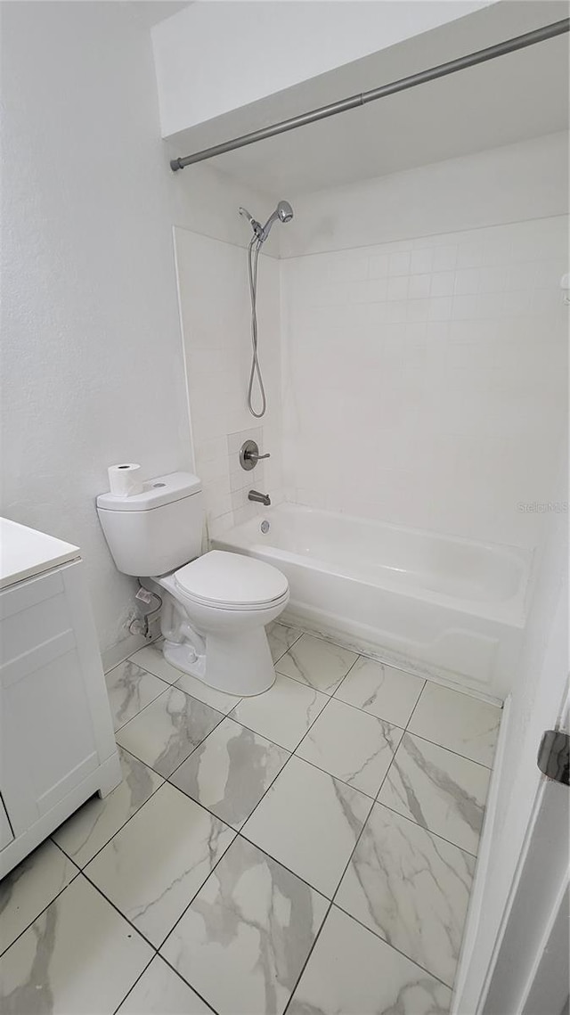 full bathroom with vanity, toilet, and tiled shower / bath combo