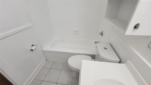 full bathroom featuring vanity, tiled shower / bath combo, and toilet