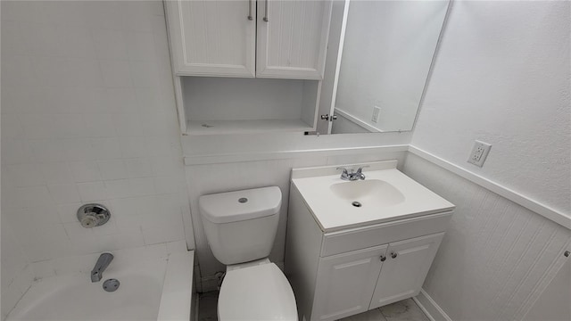 full bathroom with toilet, tiled shower / bath, and vanity