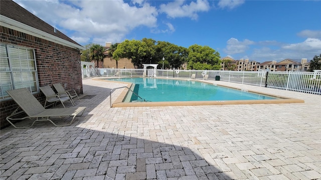 view of swimming pool featuring a patio