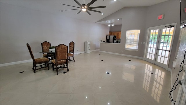 dining space featuring french doors, light tile patterned flooring, high vaulted ceiling, and ceiling fan