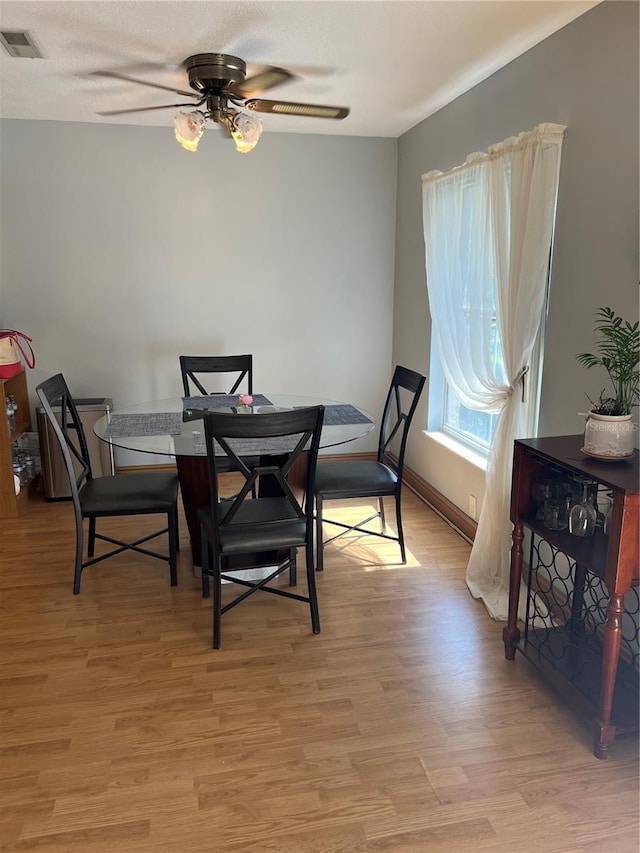 458 Windmeadows St, Altamonte Springs, FL 32701 - dining area with a ceiling fan, light wood-style flooring, and baseboards