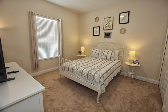314 Captiva Dr, Davenport, FL 33896 - bedroom featuring light colored carpet and baseboards