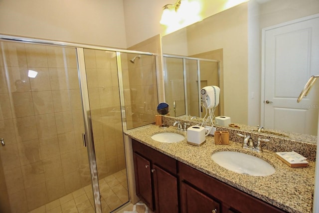 bathroom featuring vanity and an enclosed shower