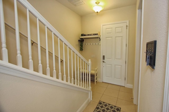 entrance foyer featuring light tile patterned floors