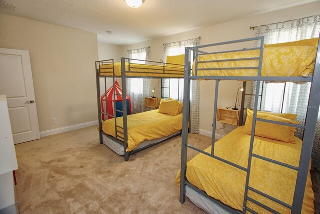 314 Captiva Dr, Davenport, FL 33896 - bedroom with carpet flooring and baseboards