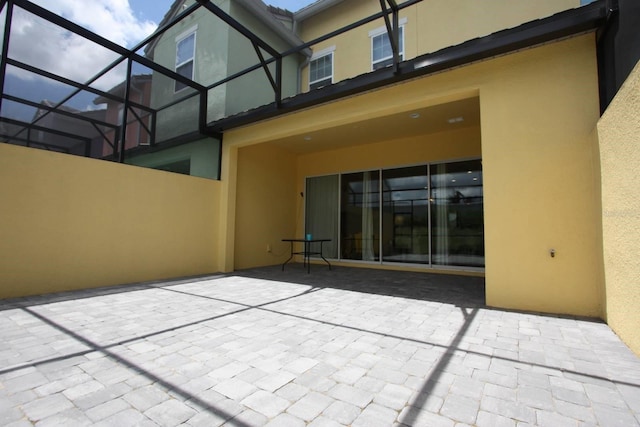 view of patio with a lanai