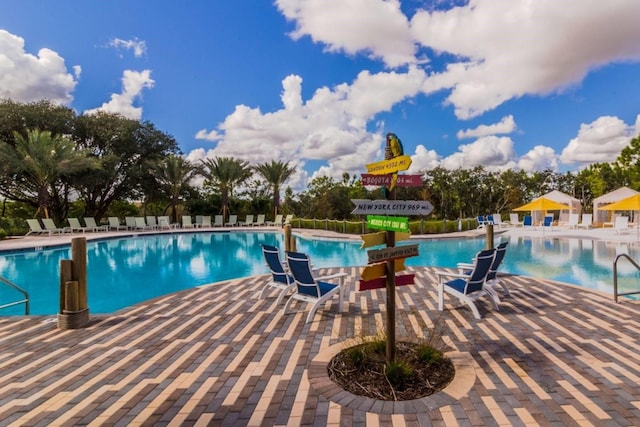 view of swimming pool featuring a patio