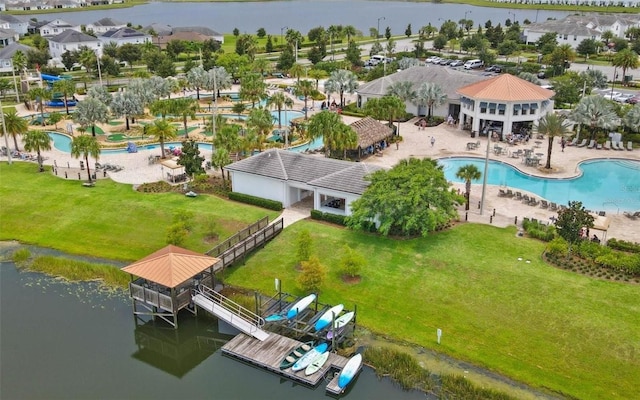 birds eye view of property with a water view