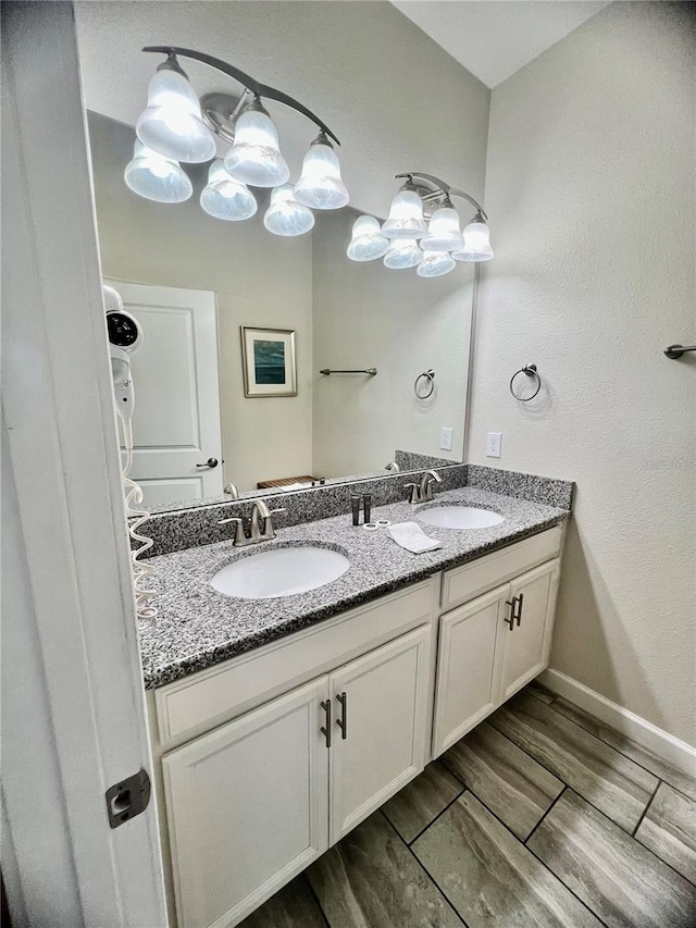 bathroom featuring vanity and wood-type flooring