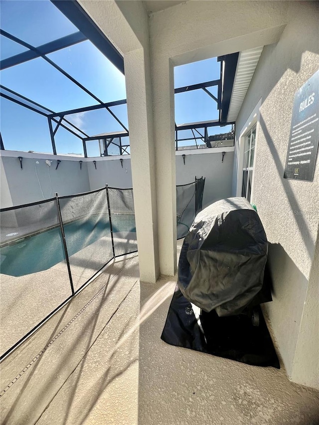 view of patio / terrace with glass enclosure