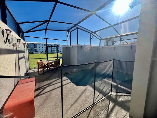 view of swimming pool with a patio and glass enclosure