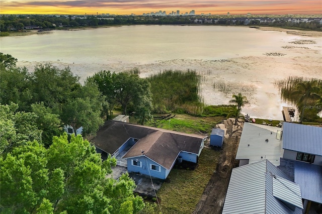 aerial view at dusk with a water view