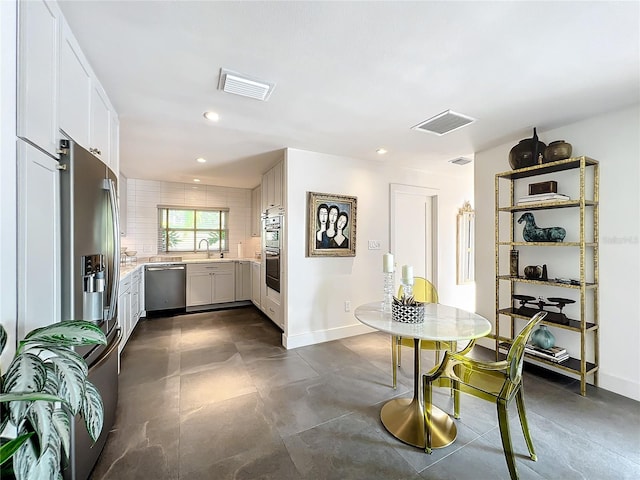 dining space featuring sink