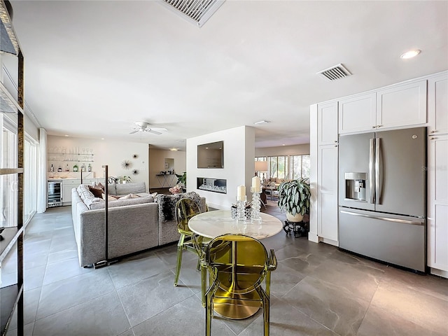 living room featuring wine cooler and ceiling fan